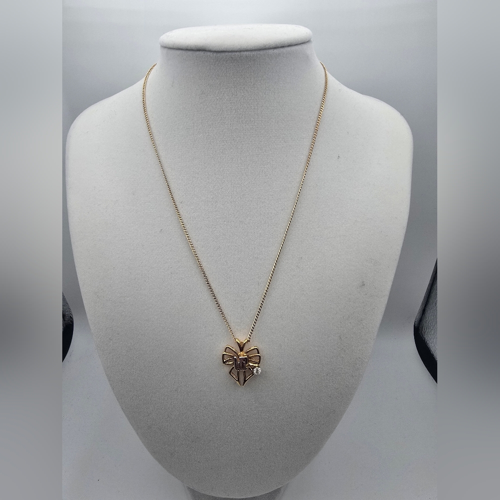 Nina Ricci Gold-tone Bow Pendant Necklace with Clear Stone